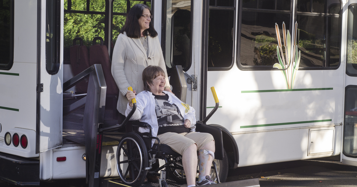 Elderly woman using senior transportation services