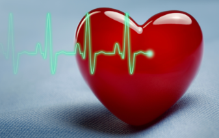 A heart shape and heartbeat and a EKG symbolize American Heart Month.