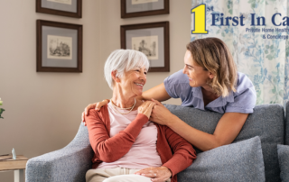 Smiling caregiver with hand over the shoulder of a happy elderly woman who is receiving home care services.