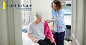 A professional caregiver helps a senior client get her coat on and get ready for the day.