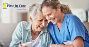 A woman who is providing companion care and her senior client laugh and enjoy their time together.