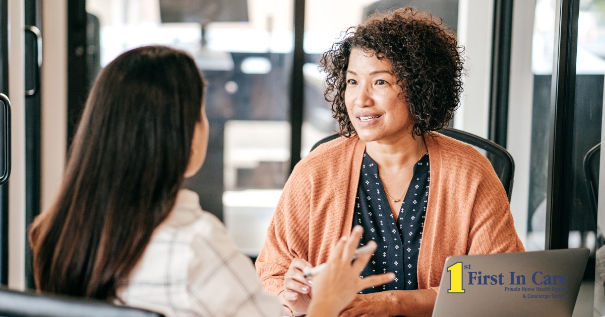 A woman interviews another woman for a caregiver job position.