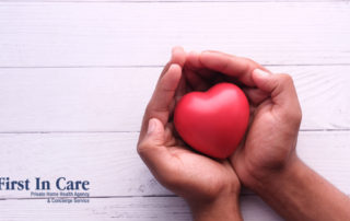 Hands holding a heart shape represent the care and support that those caring for seniors at home need.