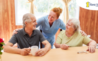 A good caregiving environment can benefit both caregiver and clients, as shown here by this caregiver and her 2 clients.