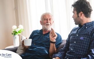 A son talks with an older parent representing the kind of communication needed to tell how aging parents are doing.