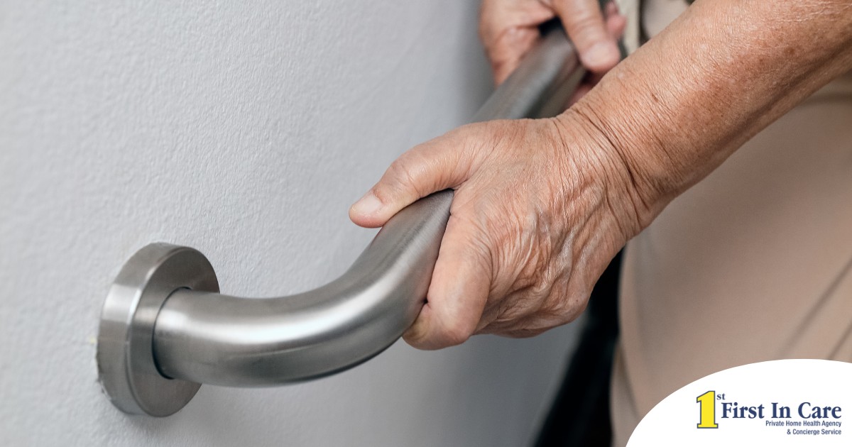 An older adult uses a grab bar representing one of the home modifications that is helpful for fall prevention for elderly adults.