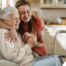 Caregiver supporting an elderly woman in the transition to senior home care