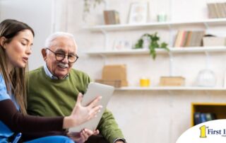 Home caregiver assisting senior man to use telehealth and senior care