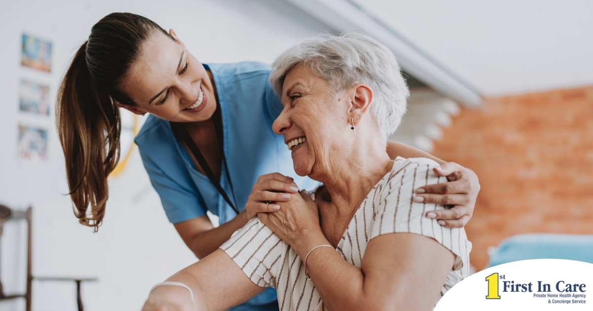 A female caregiver helping an older woman with stroke recovery at home.